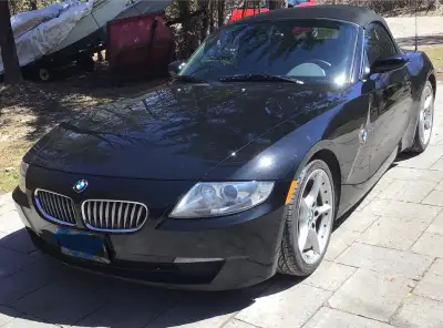 Convertible with black roof, black leather interior. 6speed manual, power windows, power roof, alloy...