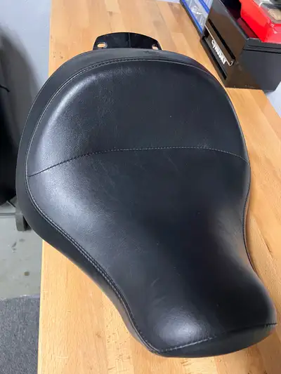 I have a mint seat off of a 2014 fat boy. It’s the seat that pushes you forward so if your shorter t...