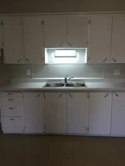 This charming and well-lit two-bedroom apartment features a classic layout with a functional kitchen...