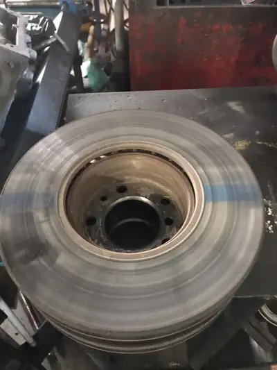 BMW 540i (1998) front brake rotors only used one month and front brake hoses, and parking brake shoe...