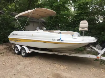 Awesome 20’ 2002 Starcraft deck boat with 2002 115 hp Mercury (four stroke) and tandem axle trailer....