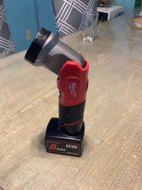 Milwaukee m12 flash light with a big 8 ah aftermarket battery 