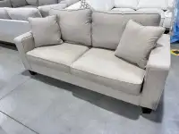 Beige herringbone patterned fabric sofa 