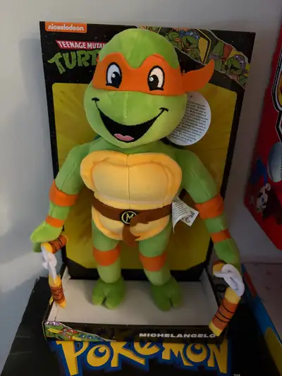 Bring home this authentic Teenage Mutant Ninja Turtles Michelangelo plush toy, perfect for fans of t...