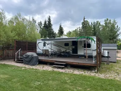 2014 Jayco Jay Flight 28BHBE on a 50'x60' leased lot at Ambrose Trailer Park. Featuring a 28'x12' de...