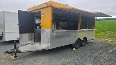Custom-built, 20-foot all-metal food trailer, equipped with a dual axle and a Honda generator. This...
