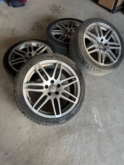 For sale are these Audi alloy rims paired with tires, sized at 235/40R18 95W. Tires only used one su...