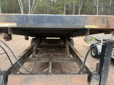 This is a Sure-Trac flatbed trailer, designed for heavy-duty hauling and equipment transport! The tr...