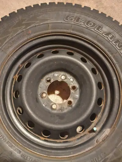 4 Toyota Tacoma 17" steel rims with older Yokohama Geolander 265/70r17 snow tire