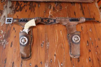 Hi. I have a vintage child's cowboy holster for sale. The leather holster shows wear and marks. The...