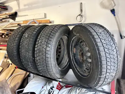 Selling a set of used winter tires with rims. Only used for two seasons, plenty of tread life remain...