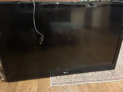 This is a used LG television, perfect for a den or spare room, and it is in fair condition. I will d...