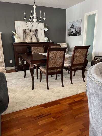 Upgrade your dining space with this elegant, pre-owned dining room table and chairs set, featuring a...