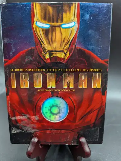 After being held captive in an Afghan cave, billionaire engineer Tony Stark creates a unique weaponi...