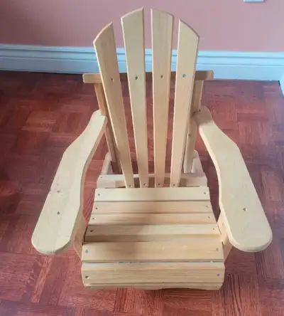 This is an Adirondack kids chair, perfect for relaxing outdoors or adding a rustic touch to your hom...
