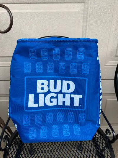 $15. New, backpack cooler. Features advertising for Bud Light and will hold 24 cans. Two ways inside...
