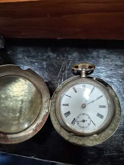 Old pocket watch in silver case in good working condition.
