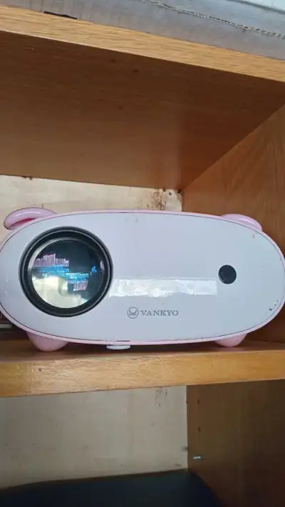 This is a used Vankyo projector that delivers a vibrant display with 1080p support, perfect for home...