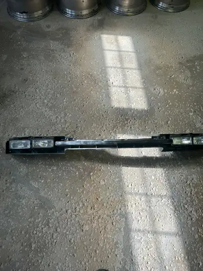 Headlamp mounting panel from a 1997 Chevy Camaro. Not sure if the lights work, but in good condition...