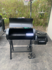 Barrel charcoal grill with offset smoker