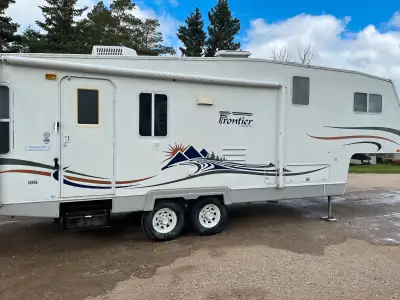 2005 28ft Frontier 5th wheel camper, propane/electric hot water heater, electric fireplace, 16” tire...