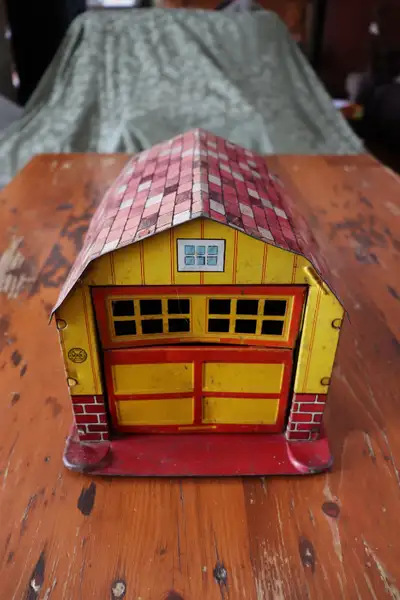 Hi. I have a vintage tin barn made by Marx for sale. The barn has a garage style door which opens wh...