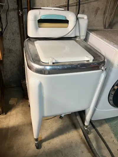 This a vintage, and classic, 1950’s Maytag wringer washer. It is in great shape in and out. All feat...