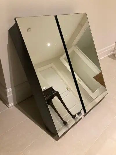 Two beautiful, mirrored, solid construction cabinets. Can be wall mounted side-by-side or separately...