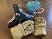 Vintage hockey skates and gloves .