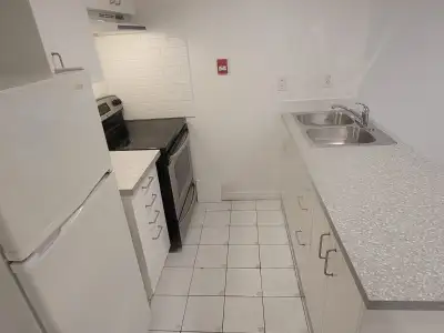 Newly RENOVATED 1 Bedroom basement apartment with a separate front entrance. New kitchen with an isl...