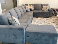 Charcoal grey sectional couch with storage ottoman