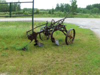 2- Antique Plows