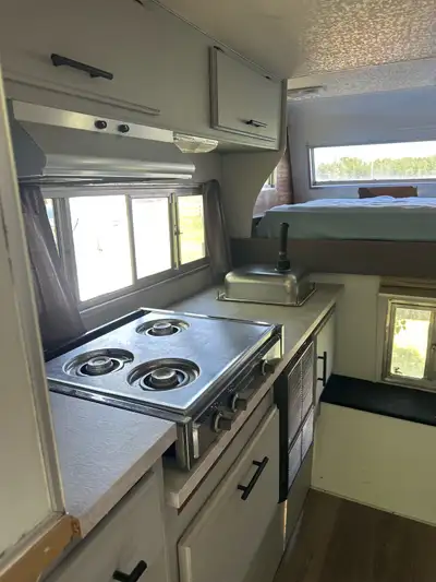 Selling a mostly renovated 1980s/1990s truck box camper — that has a surprisingly cozy interior and...