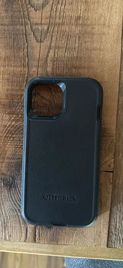 Black OtterBox phone case for IPhone 14. Located in Claresholm $10