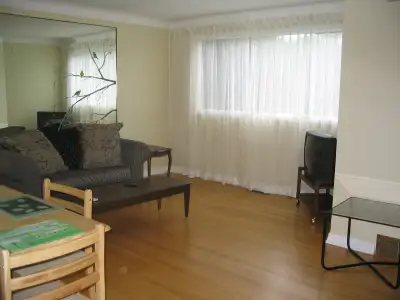 This is a quiet clean all hard wood floor house with 2.5 bathrooms and 2 fridges to share. It is a f...
