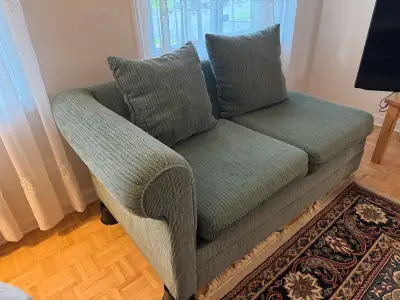 Excellent condition Love seat / 2 Seater Sofa Green fabric Can be placed flat on the ground for a lo...