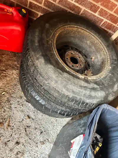 Two old truck tires on rims decent quality !