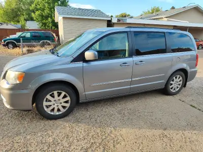 For sale is a 2012 Chrysler Town & Country minivan, perfect for families or anyone needing extra spa...