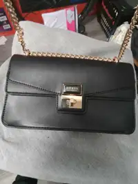 Guess purse never used.