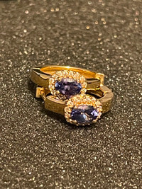 Pair of 14k yellow gold earrings set with oval cut tanzanite
