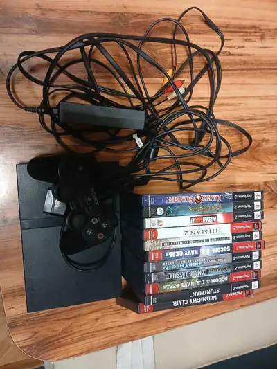 Playstation 2 slim with 11 games, View more