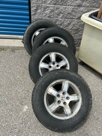 Set of 4 Honda pilot wheels and tires. Off a 2007 Honda pilot. Motomaster winter edge tires. Tires s...