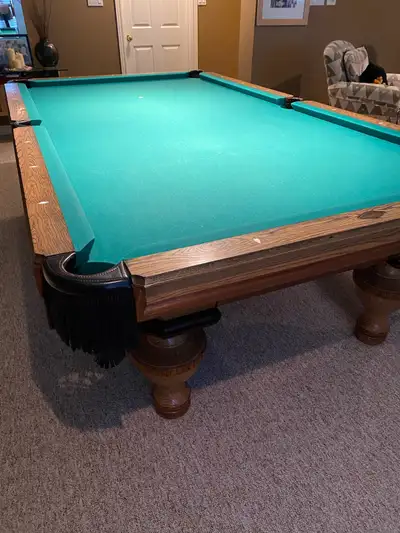 Peter Vitalie pool table 5 x 8. Pool cues, stand included. Serious buyers only. Price may be negotia...