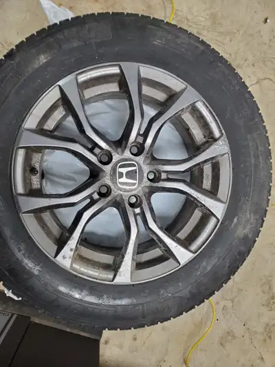 Michelin X-Ice tires on aluminum rims. Car was traded in. Tires tread depths are 7/32. Rims are bolt...