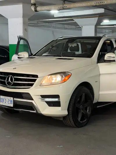 “Luxury meets reliability in this pristine 2012 white Mercedes-Benz ML350 diesel! Fully loaded with...