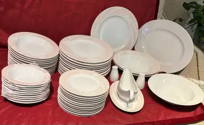 A 123-piece Mikasa Classic Flair Peach dinnerware set for 12, designed by Helena Uglow, where delica...
