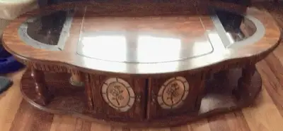 1 brown coffee table with glass inlays for sale. Asking $30 obo. Pick-up only. Only serious buyers w...