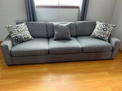Charcoal couch for sale - $400 Bought new in 2017 from Mios Good condition, comes with 3 throw pillo...