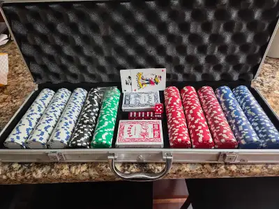 This good as new poker set comes complete with a full set of chips in various colours, two decks of...