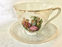 Vintage teacup & saucer white lustreware, courting couple, Japan